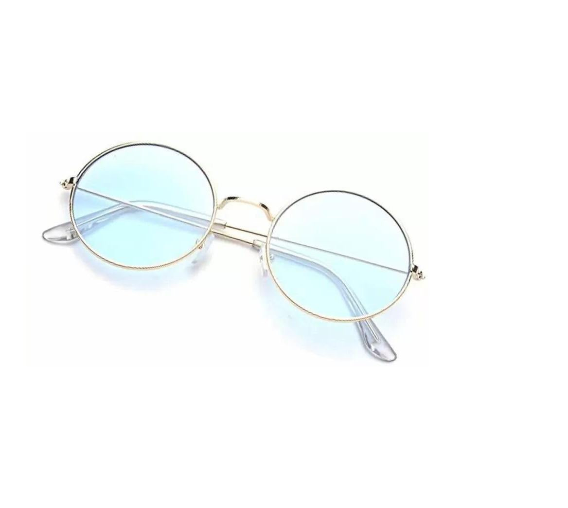 Round sunglasses with gold frame and light blue lenses on a white background