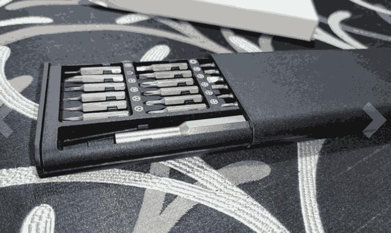 Magnetic precision screwdriver bits organized by size in protective carrying case